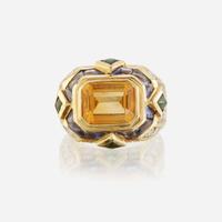 A citrine, diamond, sapphire, peridot, and eighteen karat gold ring