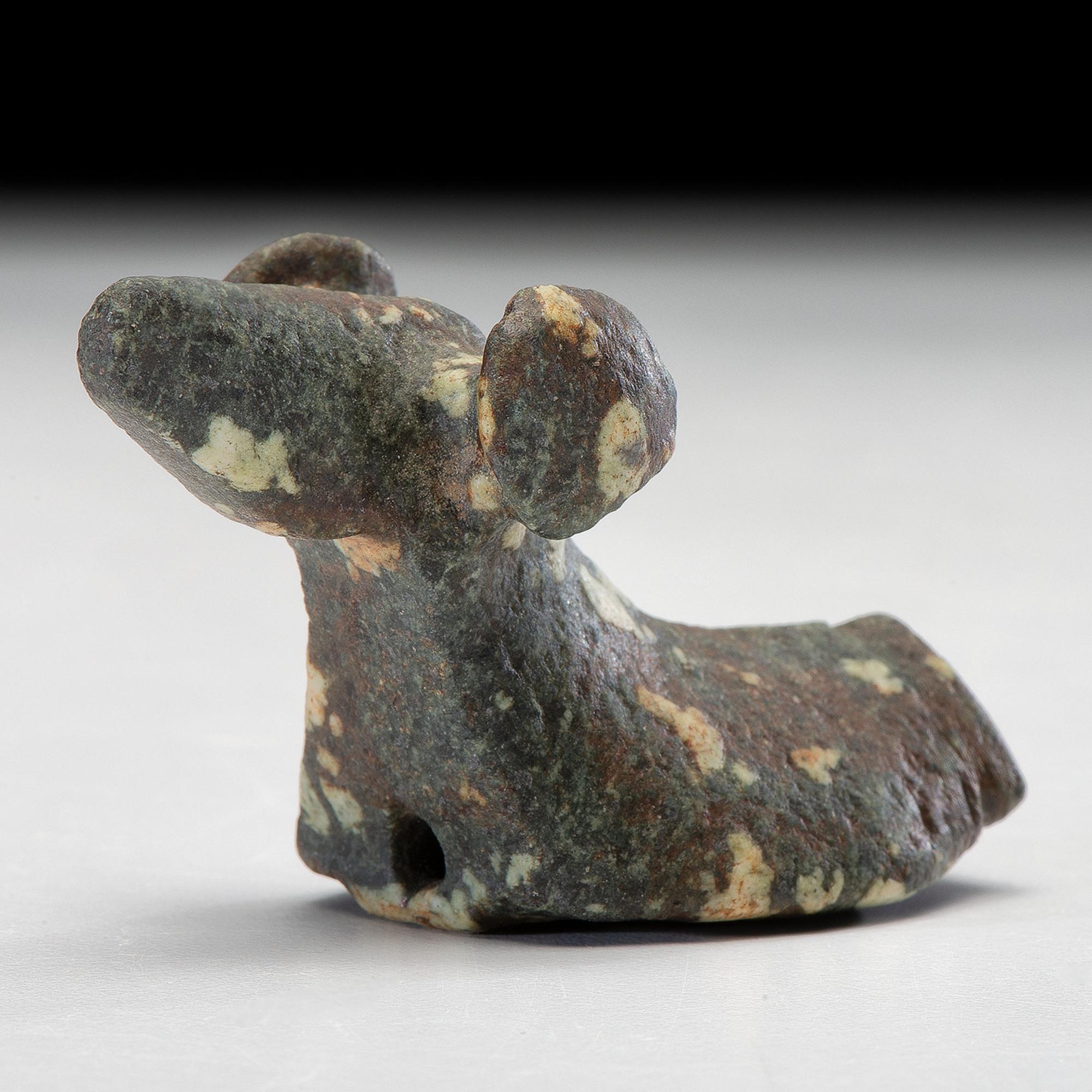 A Salvaged Porphyry Popeye Birdstone, with Red Ocher