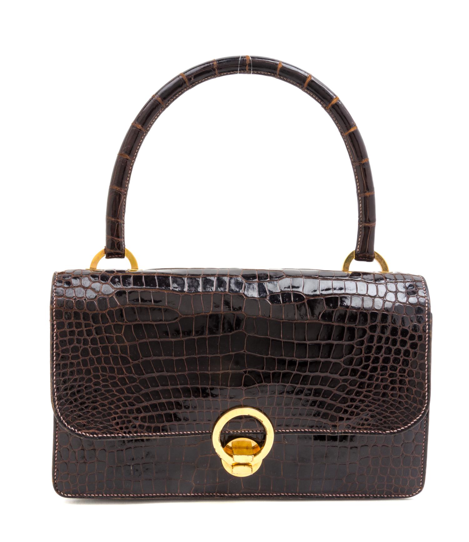 An Hermes Brown Crocodile Ring Handbag. 10" x 6.5" x 1.5".