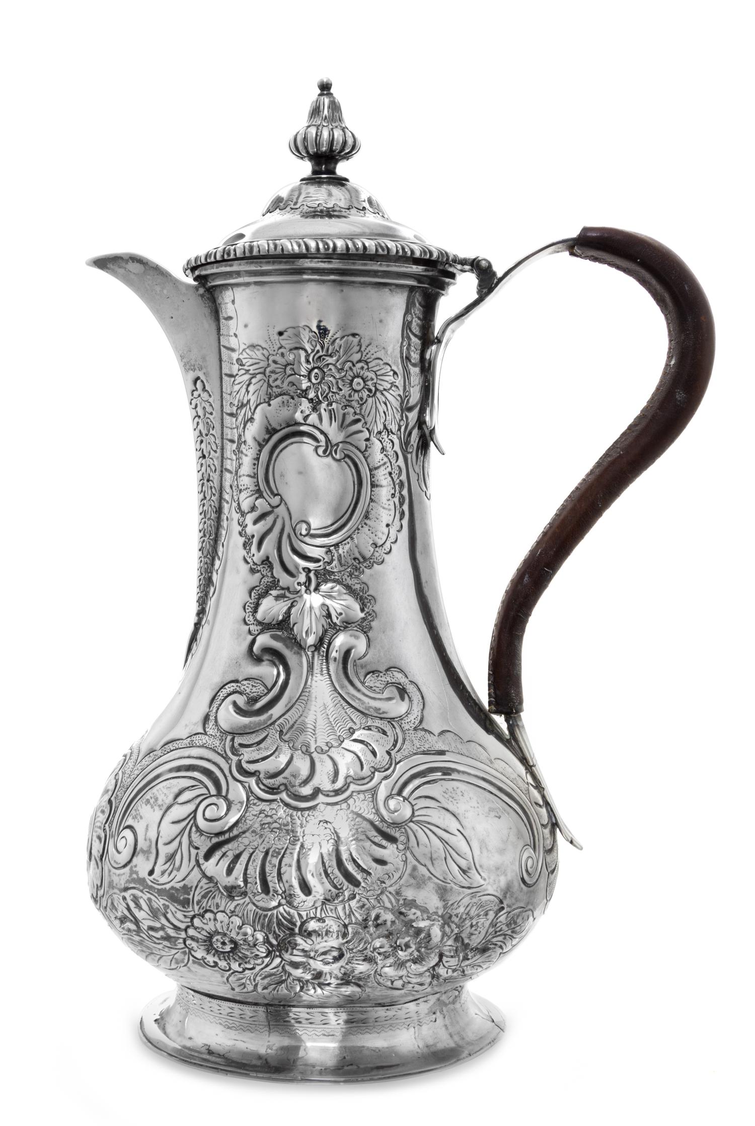 A George III Silver Coffee Pot, Louis Herne & Fras. Butty, London, 1762, of baluster form with a leather bound handle and spread circul