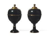 A Pair of Large Black Enameled and Brass Lidded Urns DONATED BY NATE BERKUS