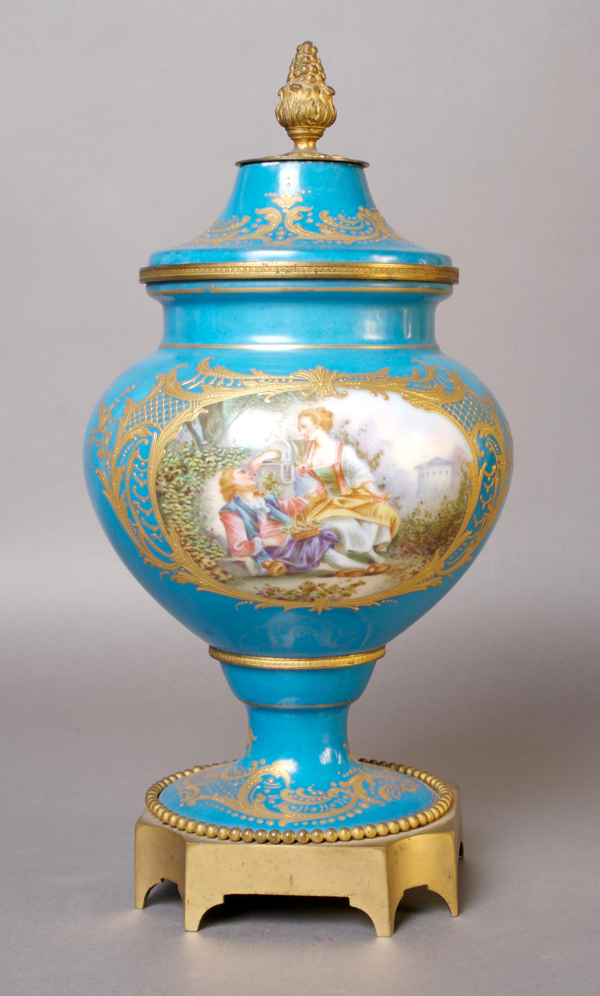 A Sevres Style Lidded Urn, Height 12 1/2 inches.