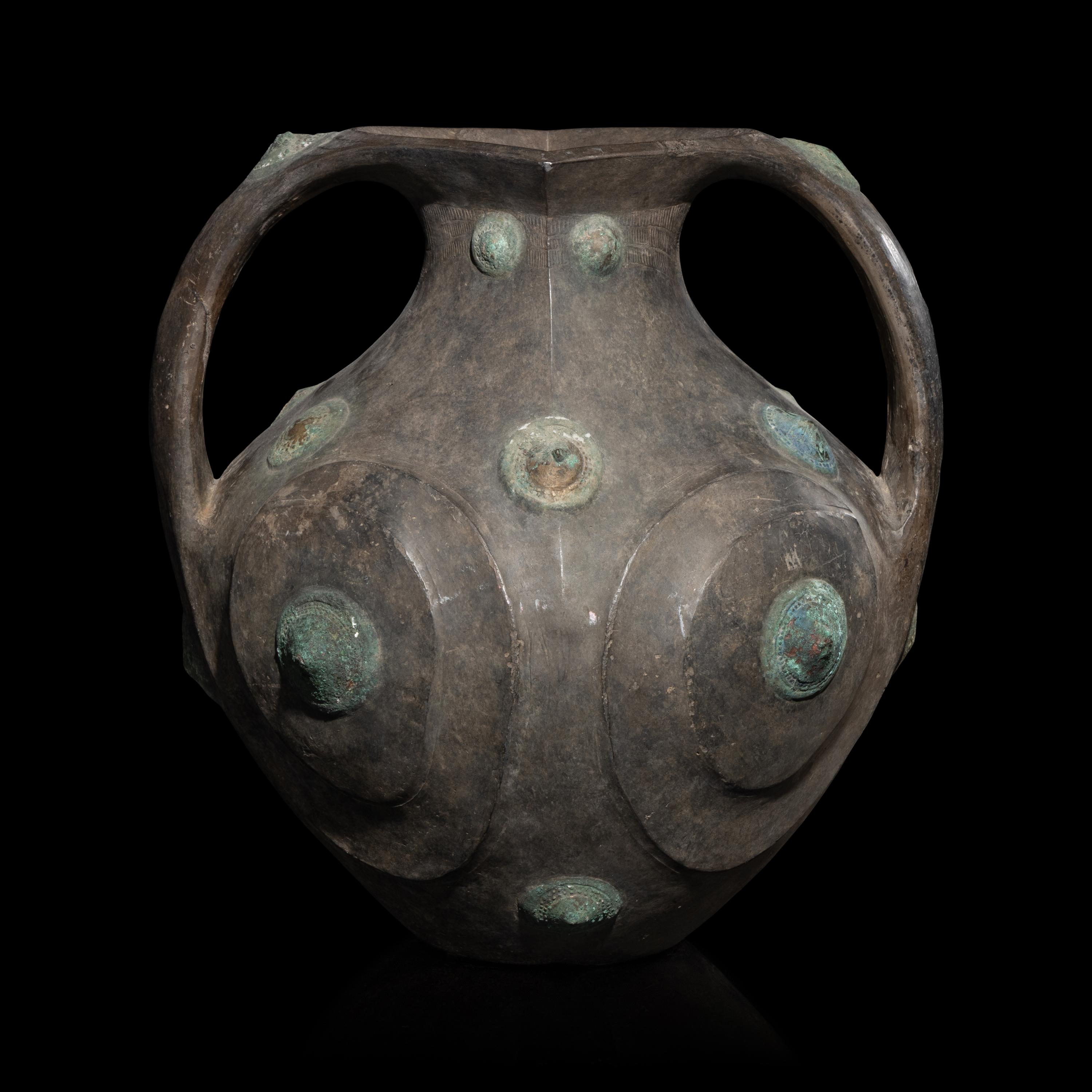 A Chinese Grey Pottery Amphora with Metal Boss Appliques, Western Han Dynasty — 西漢 黑陶嵌铜泡钉双耳壶