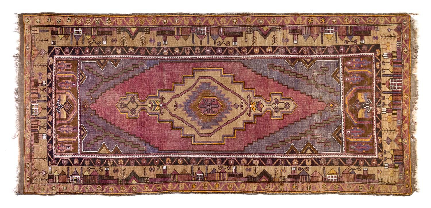A Turkish Wool Rug 8 feet 2 inches x 4 feet.