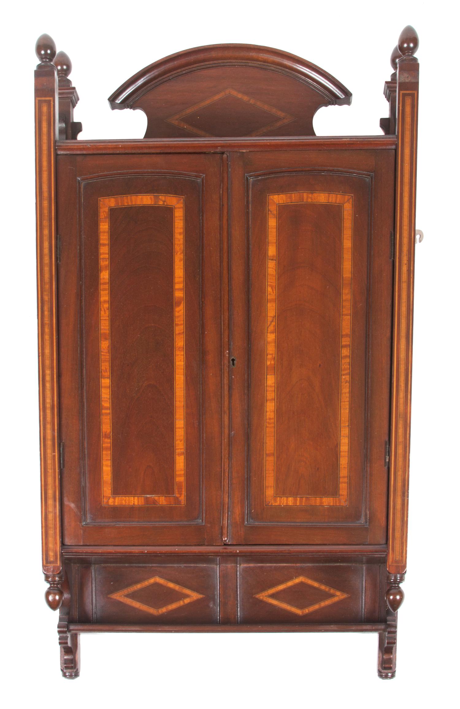A Mahogany Barber Wall Cabinet Height 38 x width 22 x depth 7 inches.