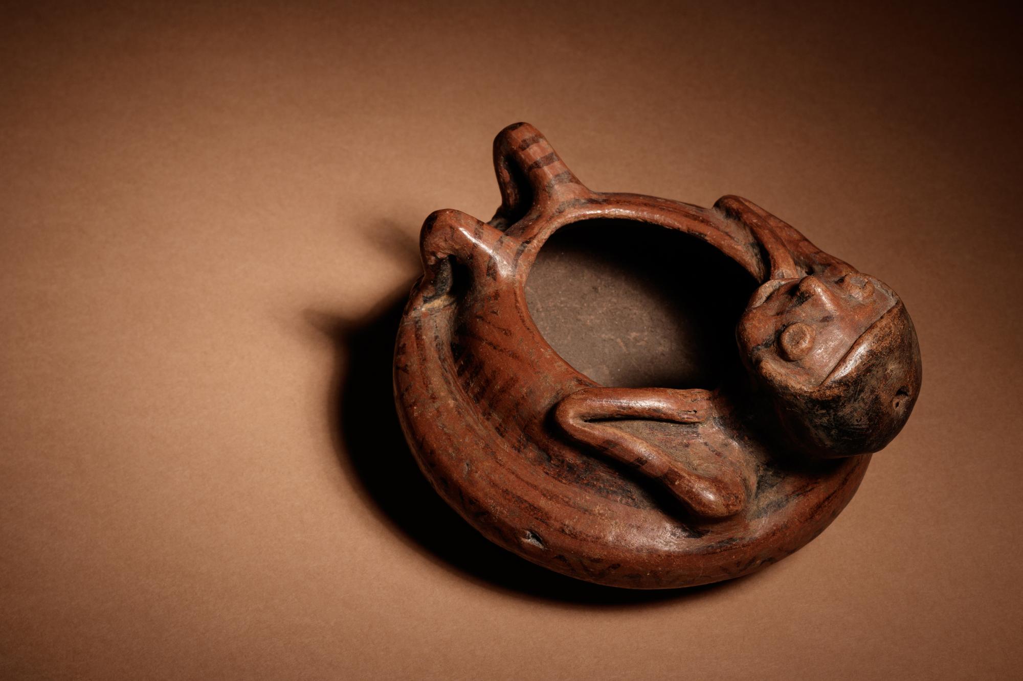 A Narino Terracotta Vessel of a Lying Man
