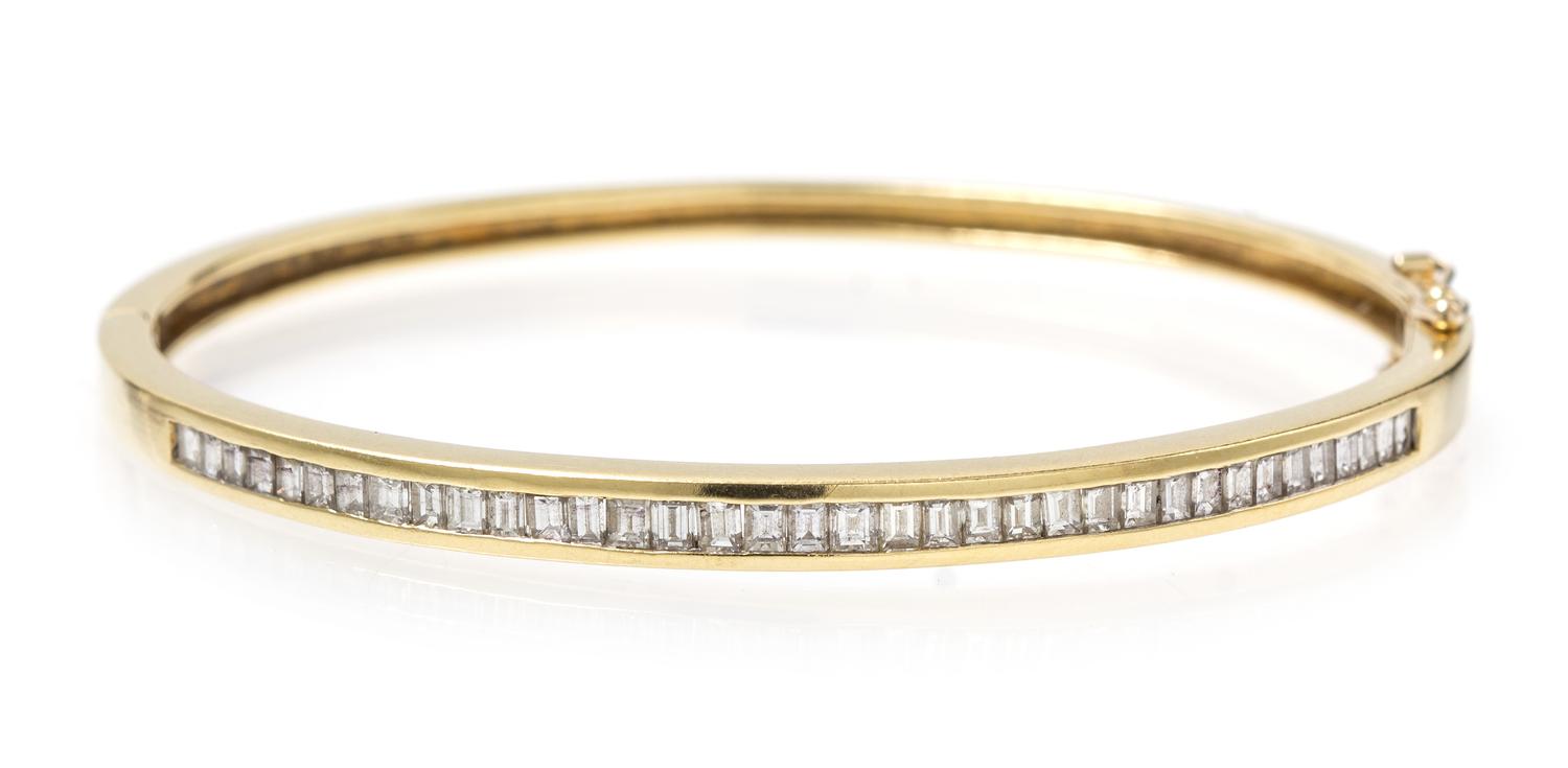 An 18 Karat Yellow Gold and Diamond Hinged Bangle Bracelet, 10.80 dwts.