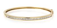 An 18 Karat Yellow Gold and Diamond Hinged Bangle Bracelet, 10.80 dwts.