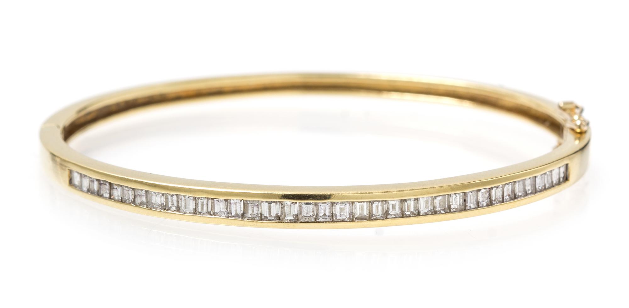 An 18 Karat Yellow Gold and Diamond Hinged Bangle Bracelet, 10.80 dwts.