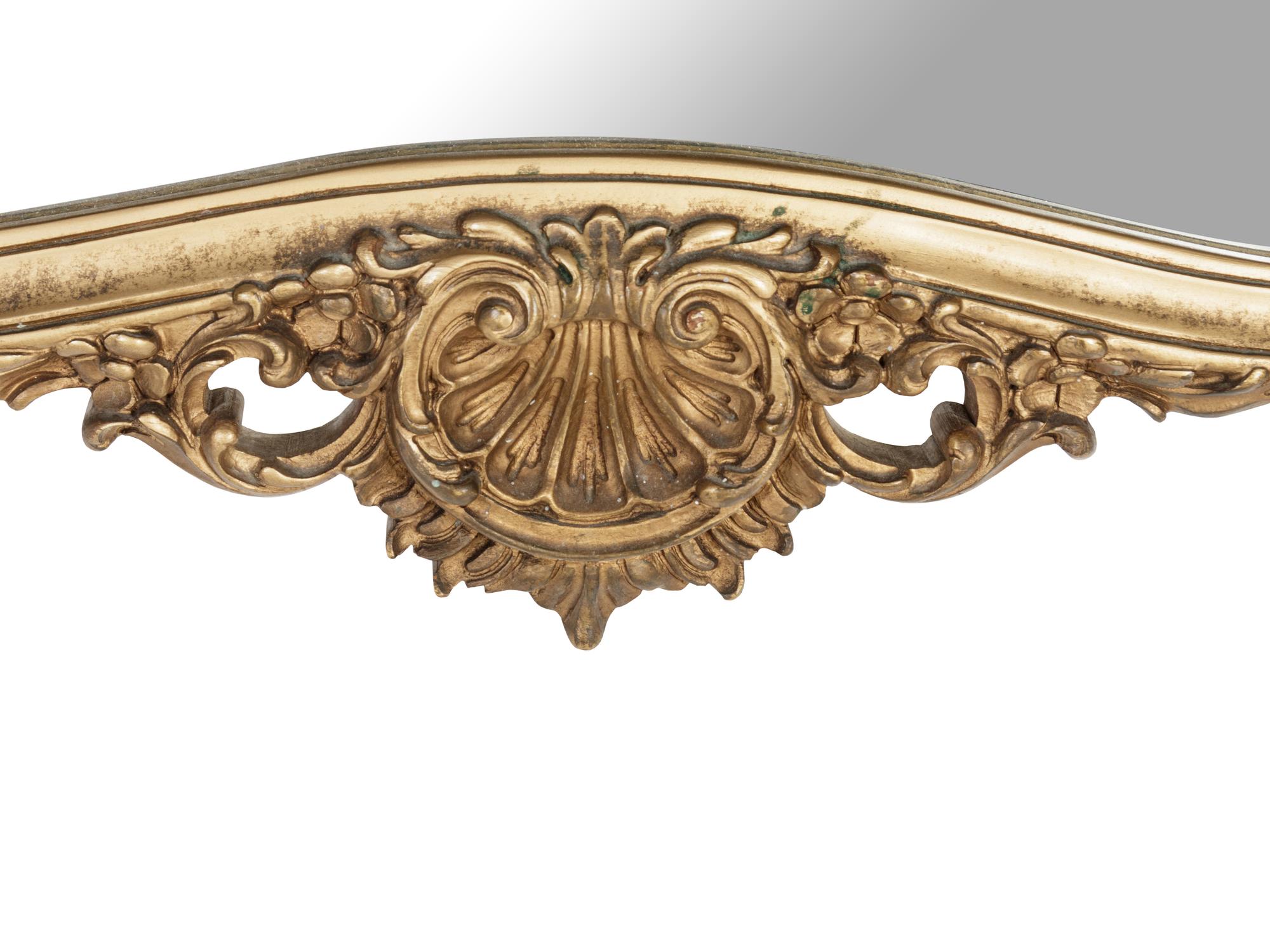 A Rococo Style Giltwood Mirror