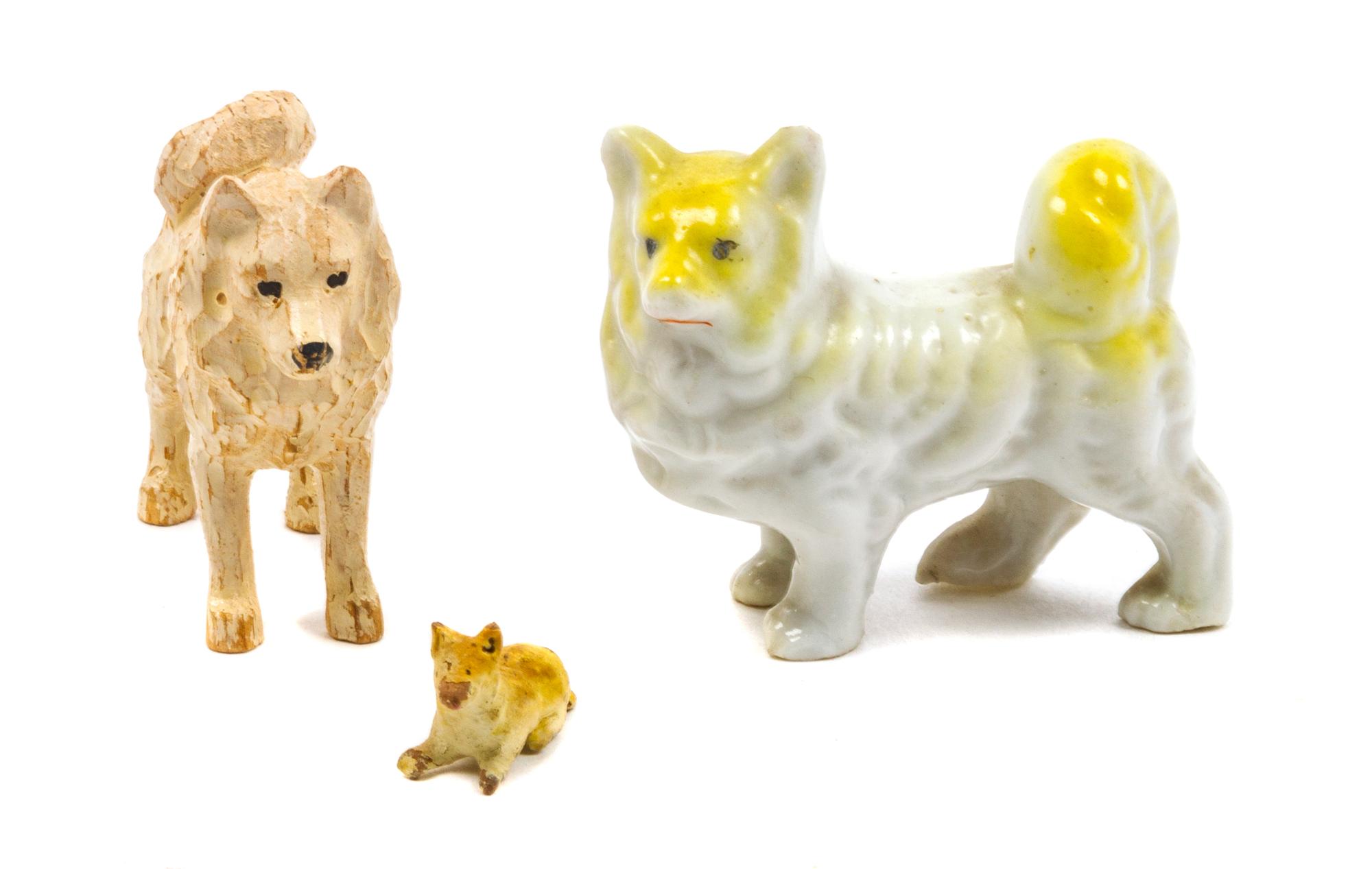 Three Finnish Spitz Figures Width of widest 1 3/4 inches.