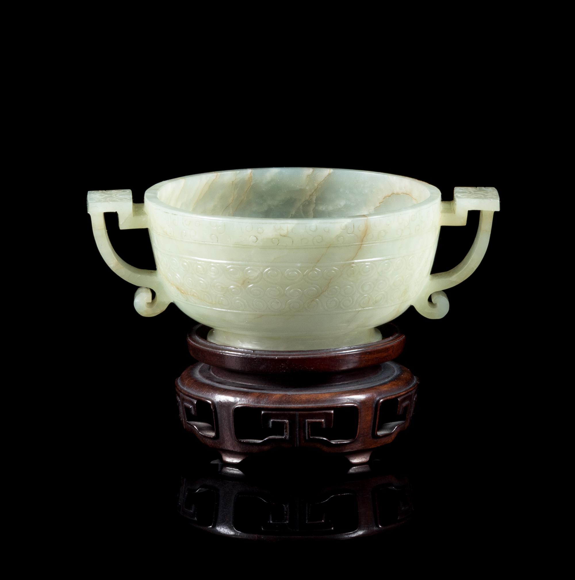 A Celadon and Russet Jade Handled Cup Length 4 3/8 inches. — QING DYNASTY (1644-1912)