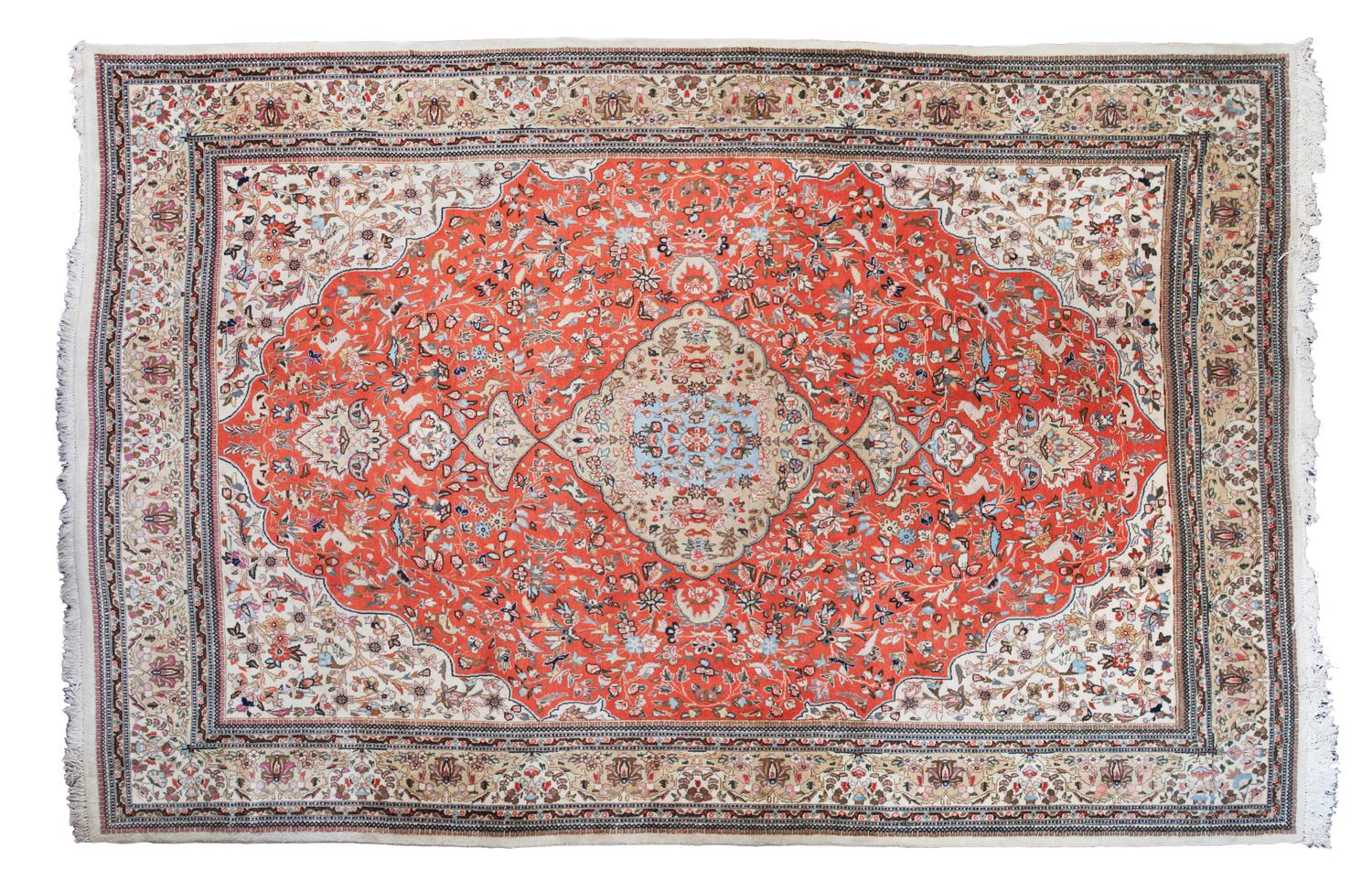 A Tabriz Wool Rug 11 feet 4 inches x 8 feet 4 inches.