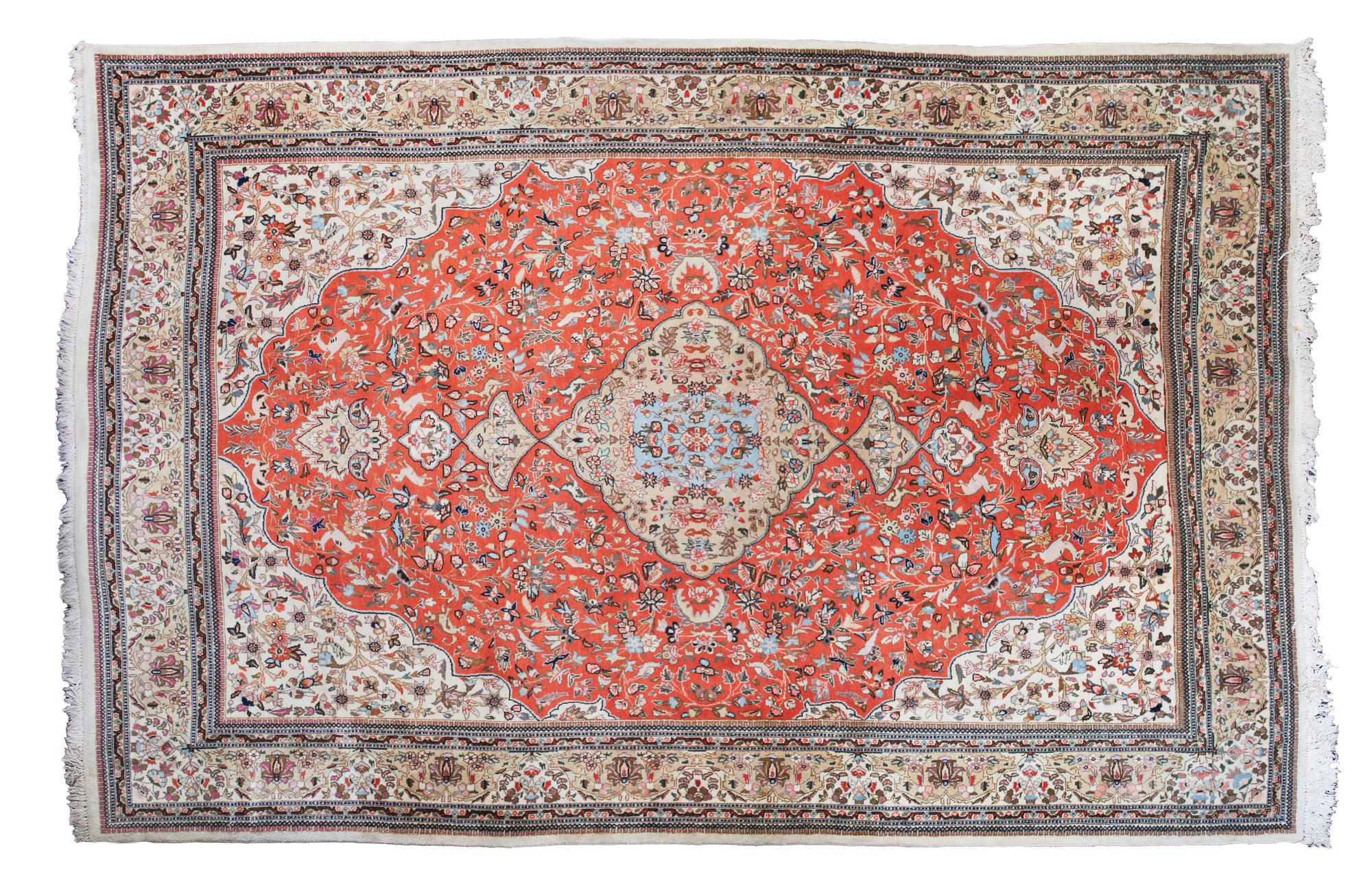 A Tabriz Wool Rug 11 feet 4 inches x 8 feet 4 inches.
