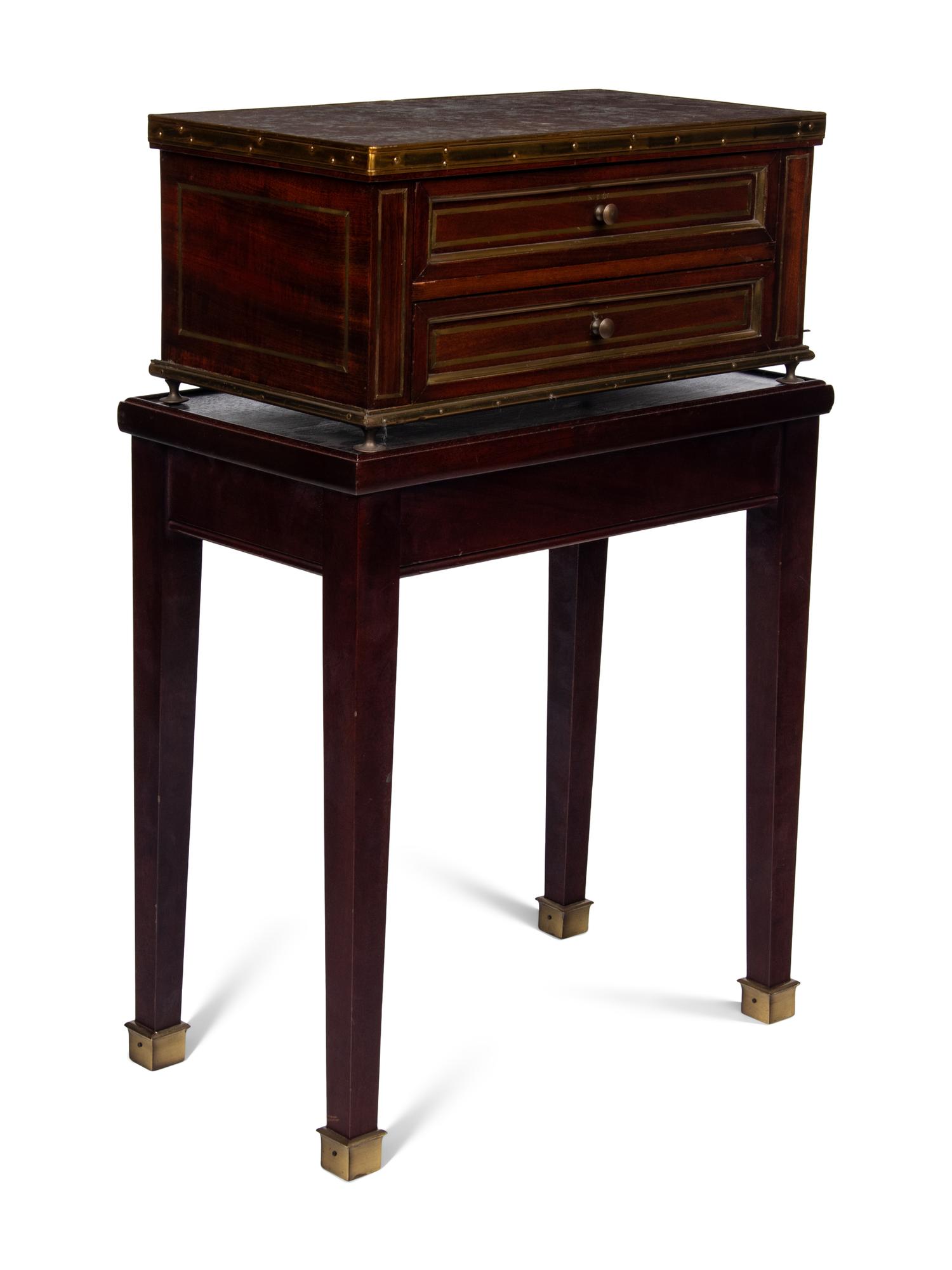 A Directoire Style Mahogany Marble-Top Chest on a Stand