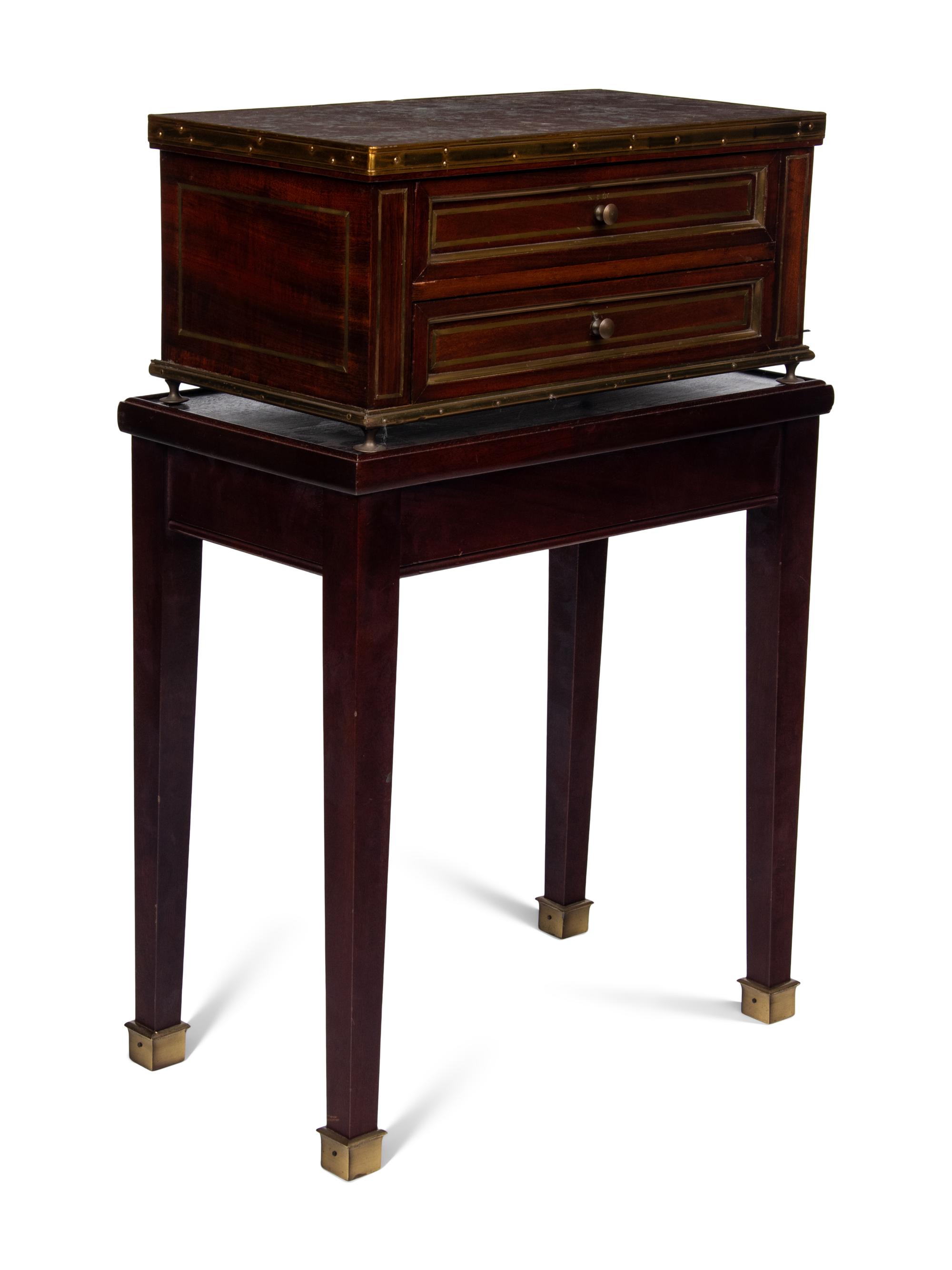 A Directoire Style Mahogany Marble-Top Chest on a Stand