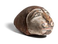 An Egyptian Polychrome Wood Head of a Lion