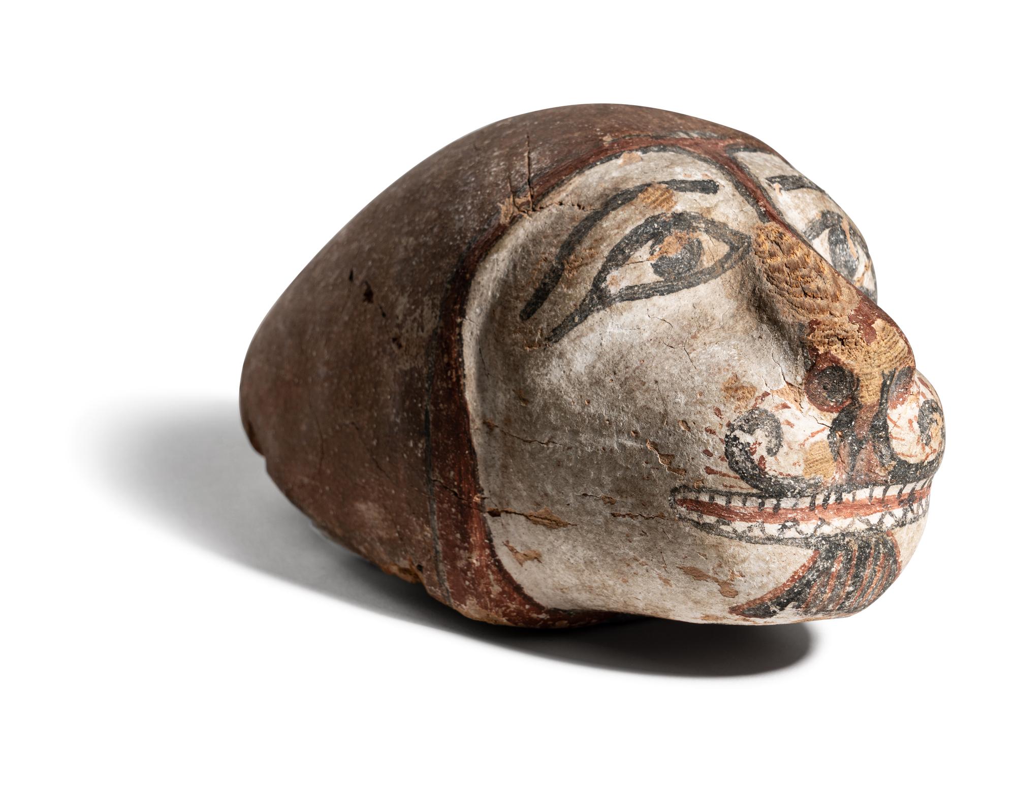 An Egyptian Polychrome Wood Head of a Lion