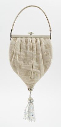 A Judith Leiber Cream Silk Textured Handbag, 5.5" x 10" x 1"; Handle drop: 3".