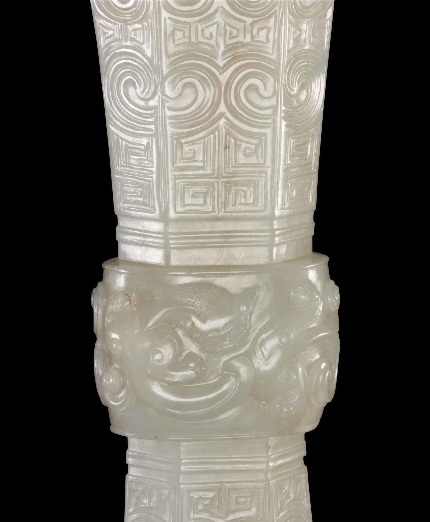A Carved White Jade Gu Vase