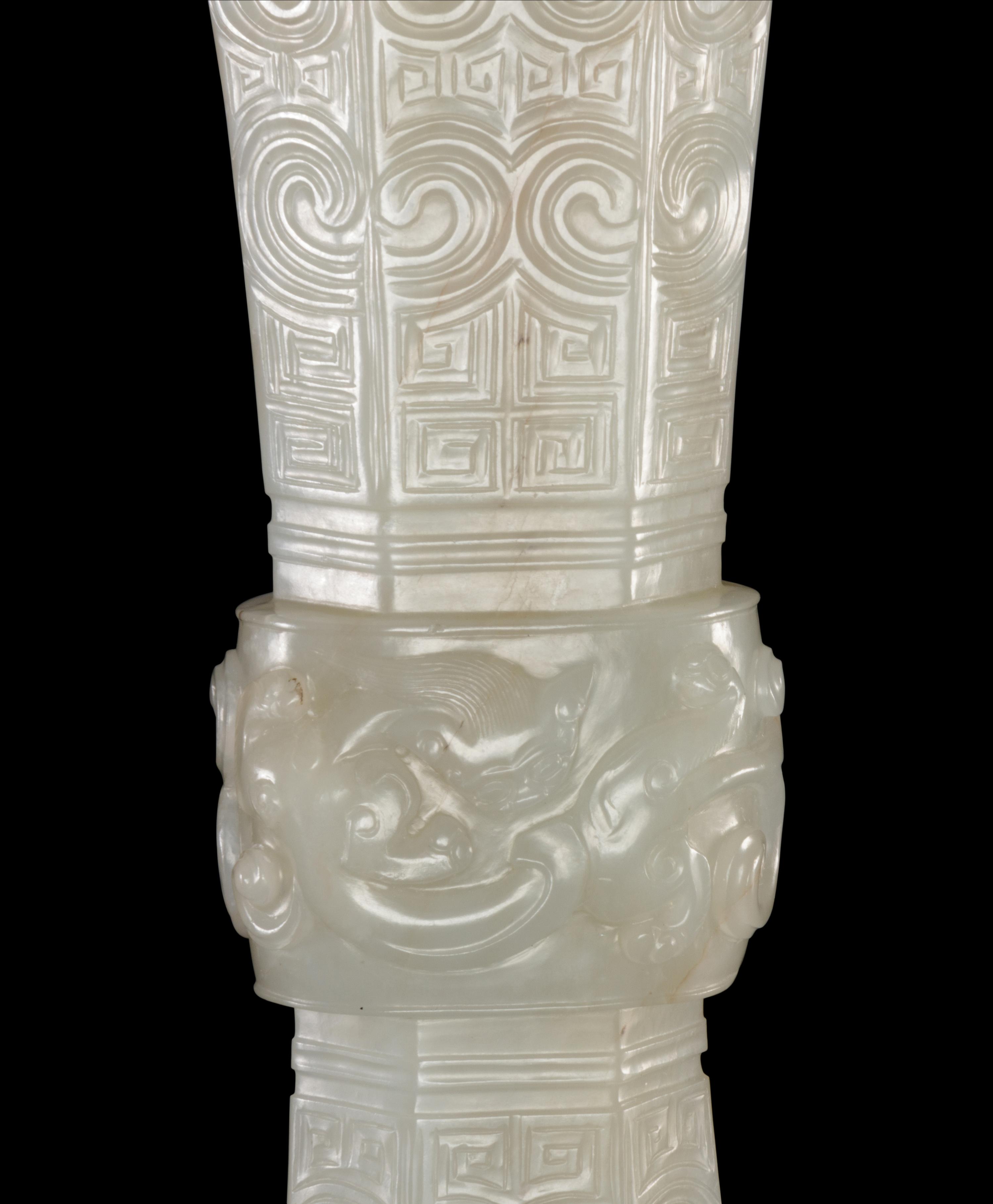 A Carved White Jade Gu Vase