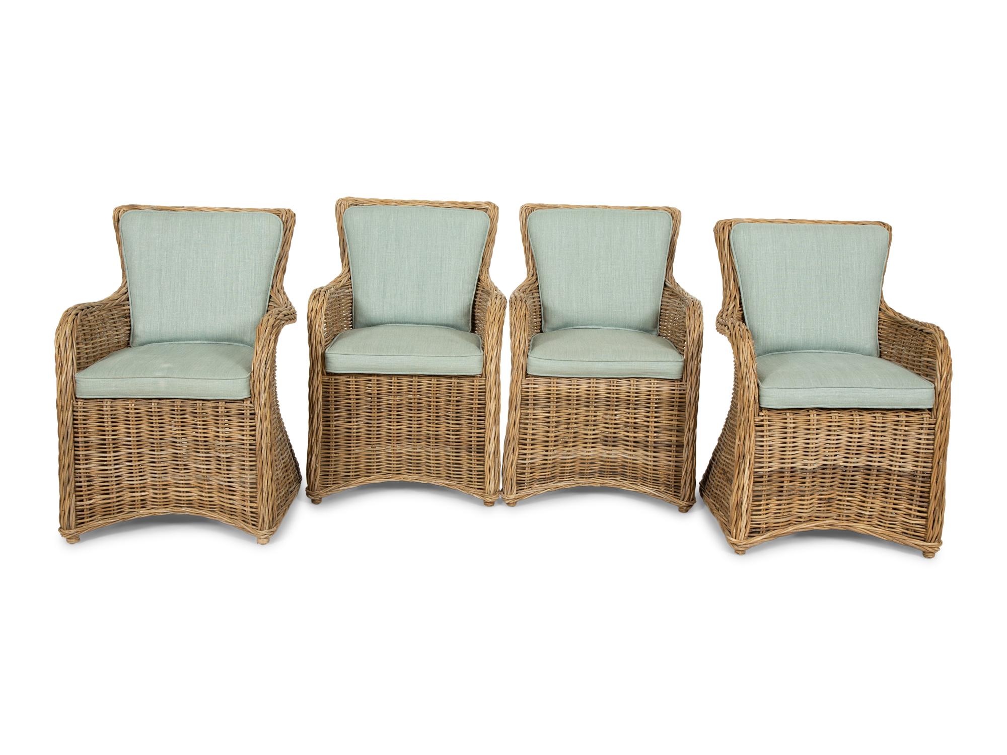 A Set of Four Rattan Armchairs with Seat and Back Cushions