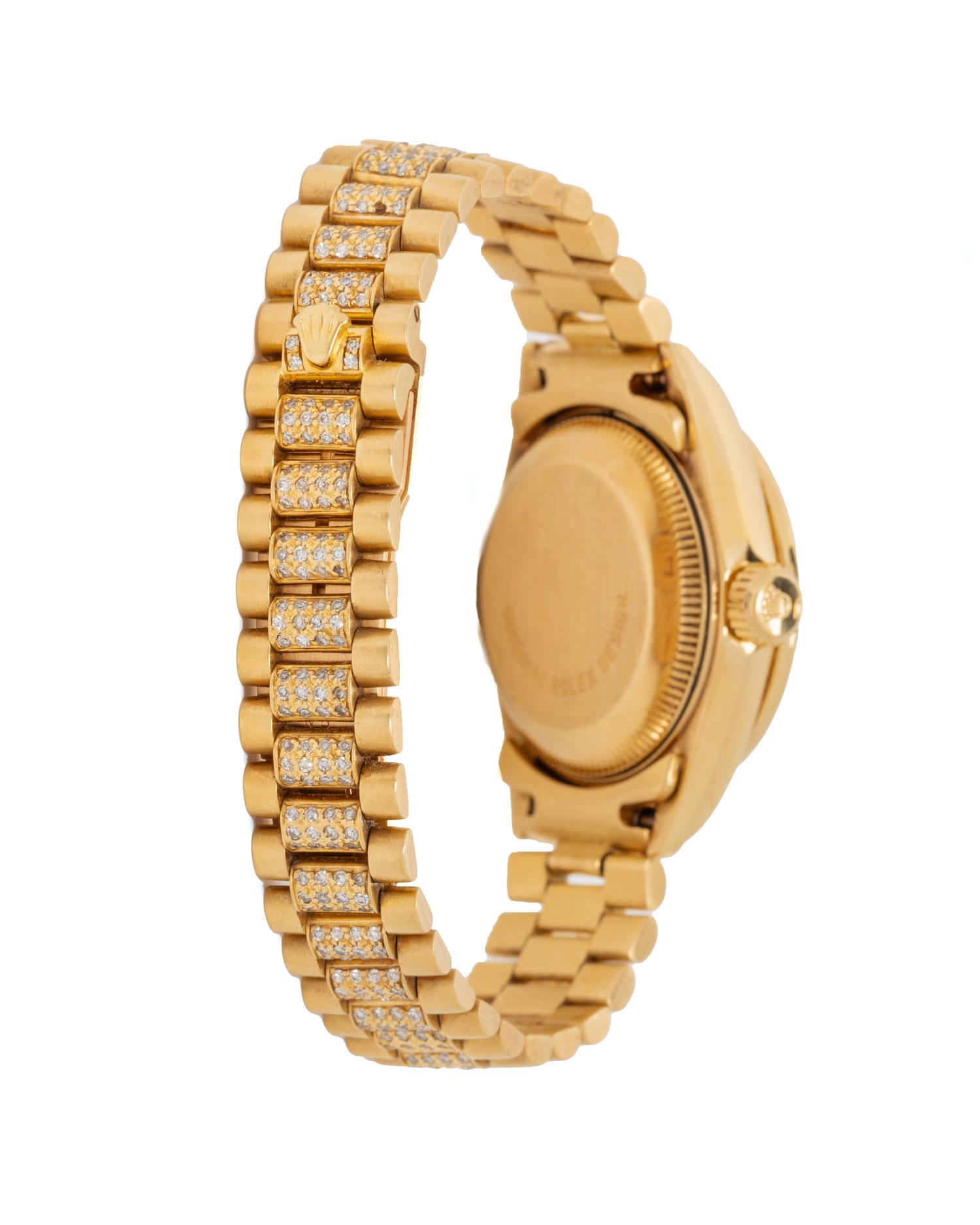 ROLEX, REF. 69068 18K YELLOW GOLD, DIAMOND, AND RUBY 'LADY DATEJUST' WATCH WITH DIAMOND PRESIDENT BRACELET
