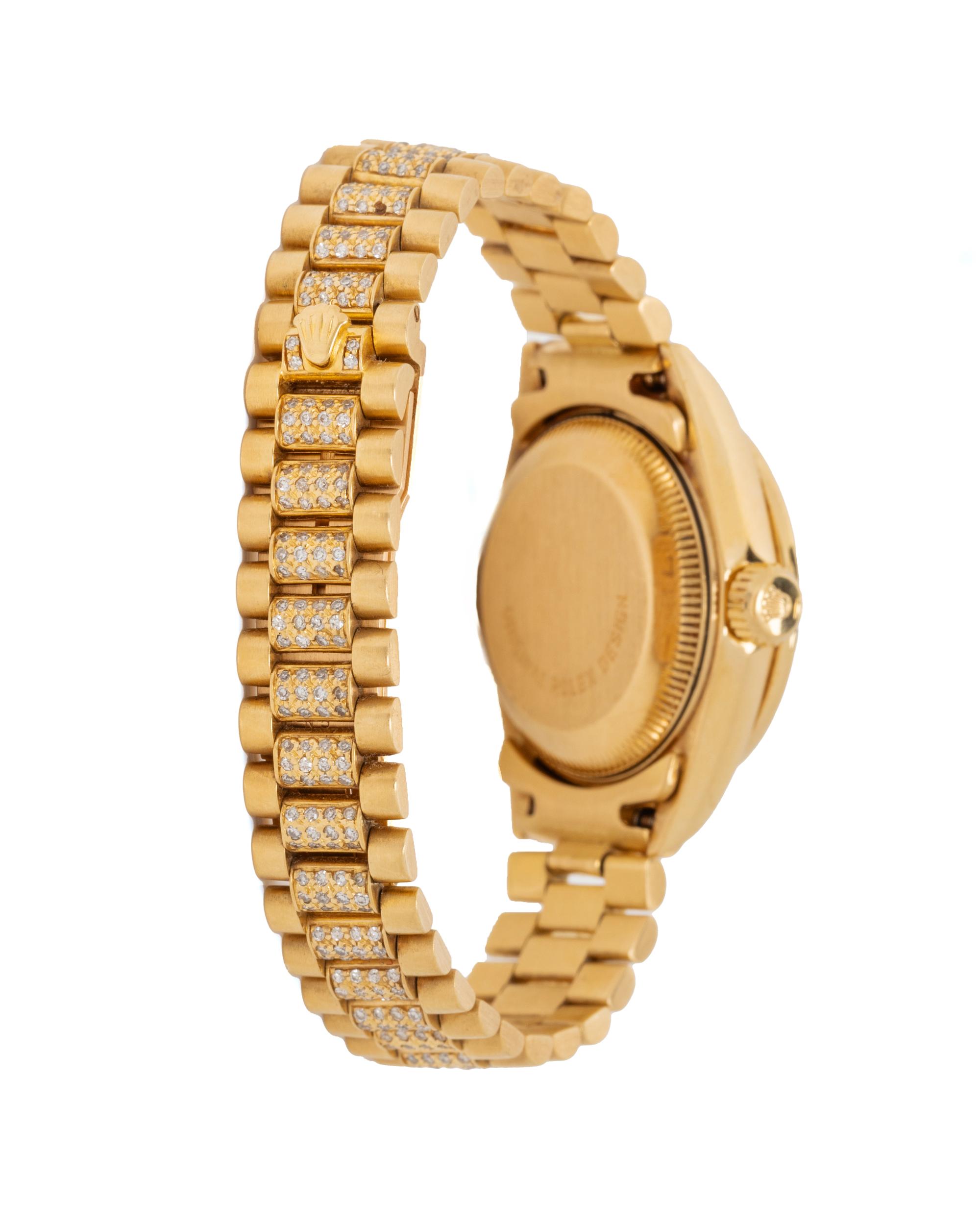ROLEX, REF. 69068 18K YELLOW GOLD, DIAMOND, AND RUBY 'LADY DATEJUST' WATCH WITH DIAMOND PRESIDENT BRACELET