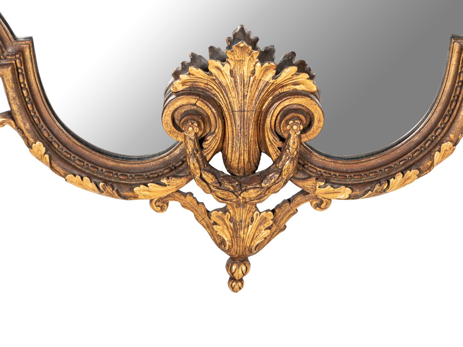 An Italian Baroque Style Giltwood Mirror
