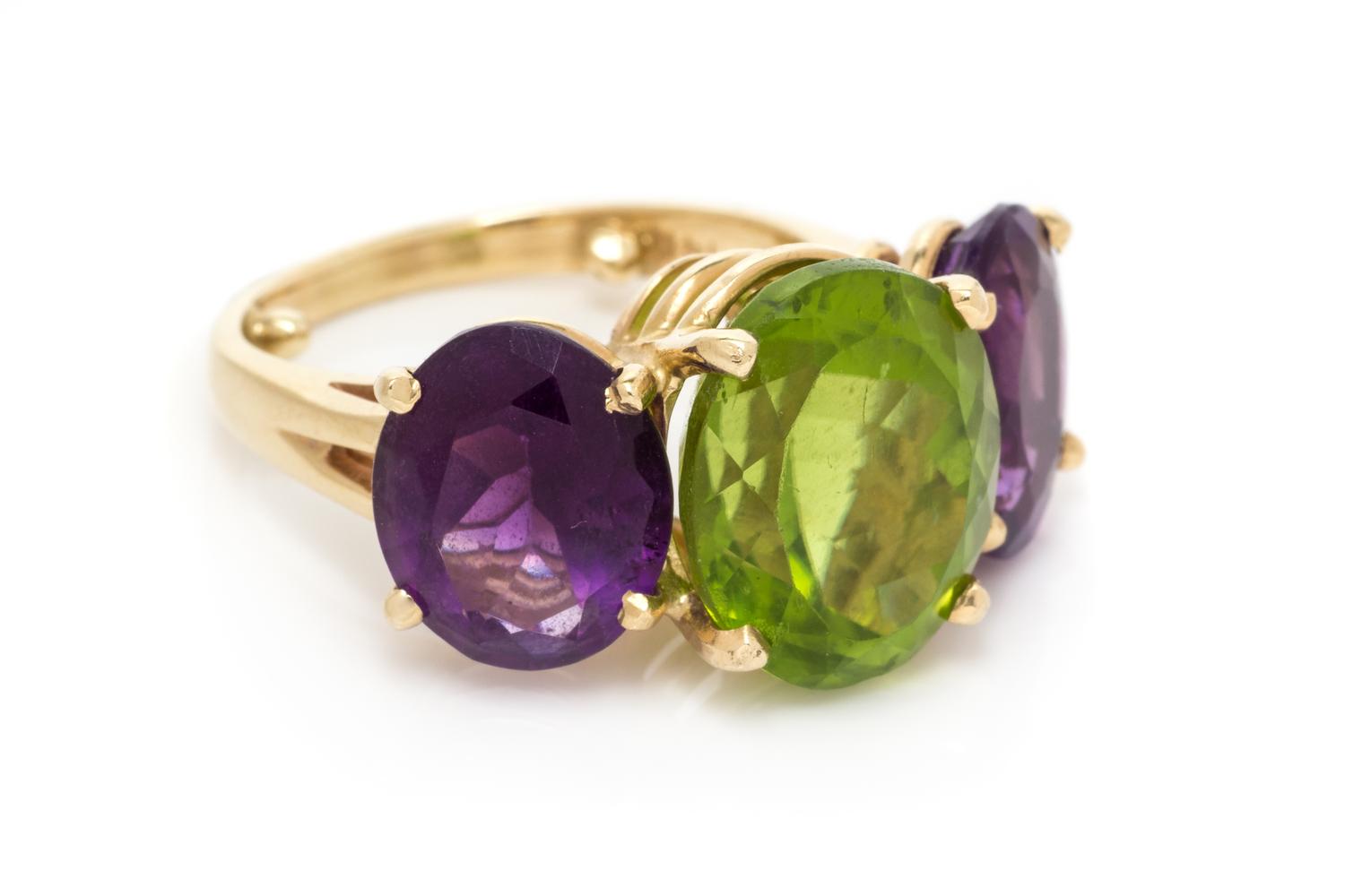 A 14 Karat Yellow Gold, Peridot and Amethyst Ring, 5.95 dwts.