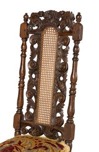 A Set of Four William and Mary Style Carved Oak Dining Chairs