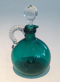 A Green Glass Decanter with Stopper Height 9 inches.