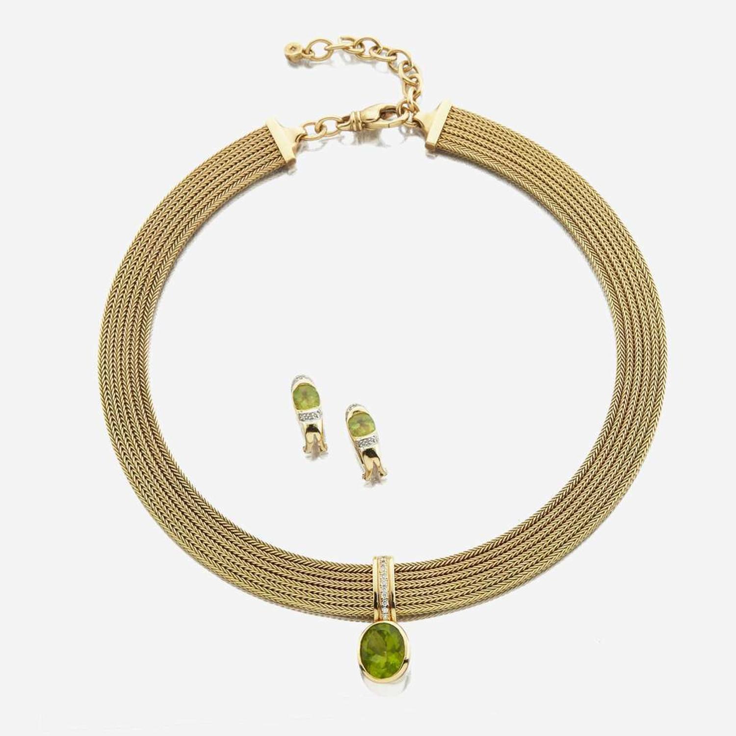 A peridot, diamond, and gold necklace