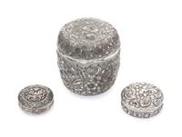 A Group of Three American Silver Boxes, , each decorated with floral and foliate decoration, the two smaller examples with engraved mon