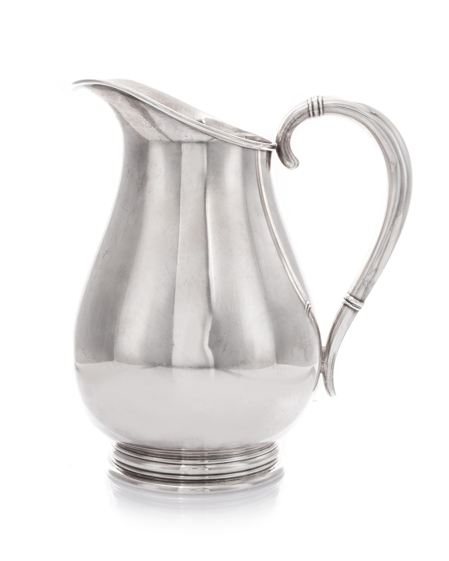 An American Silver Pitcher, International Silver Co., Meriden, CT, in the Royal Danish pattern, of baluster form, the handle having ban