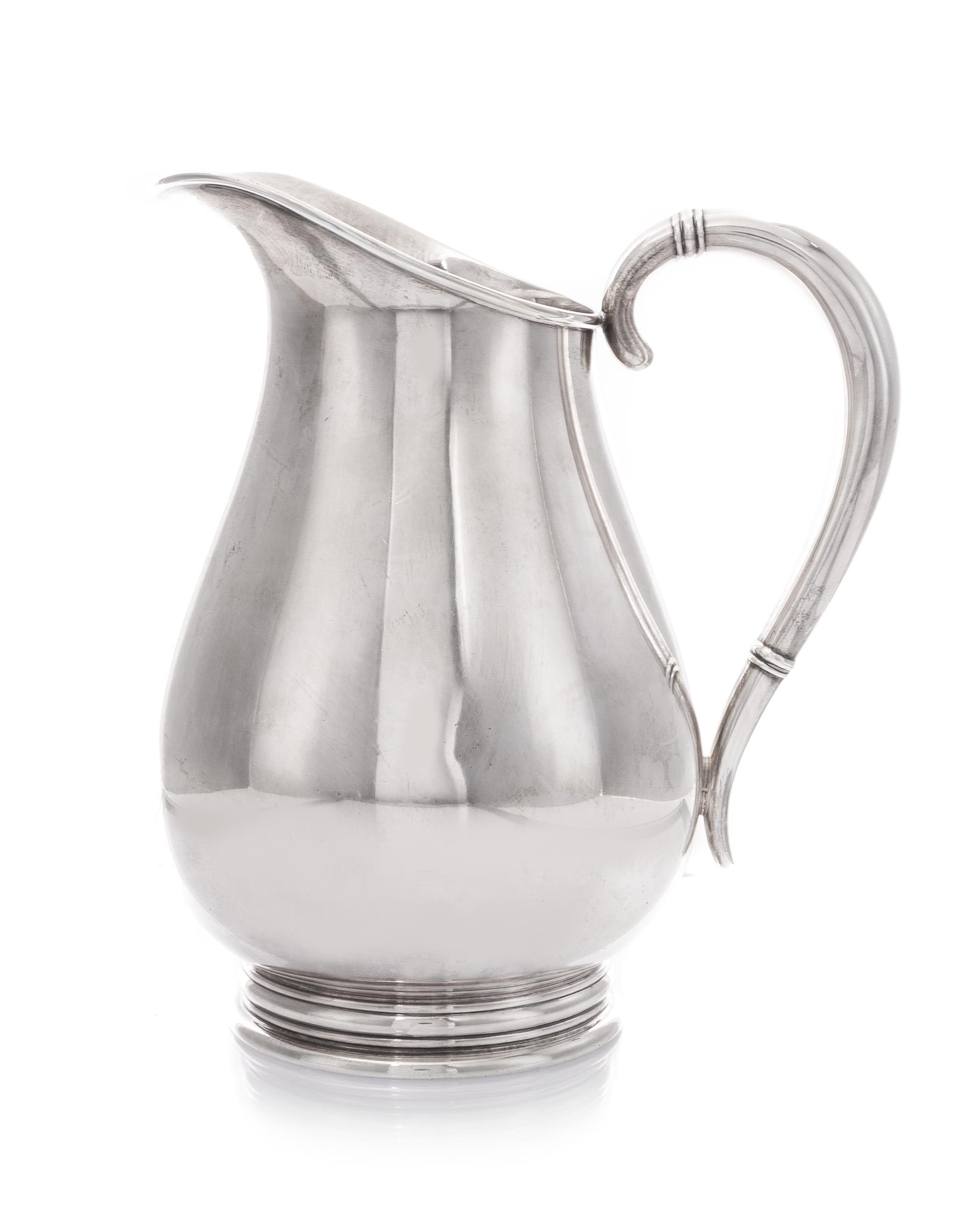 An American Silver Pitcher, International Silver Co., Meriden, CT, in the Royal Danish pattern, of baluster form, the handle having ban