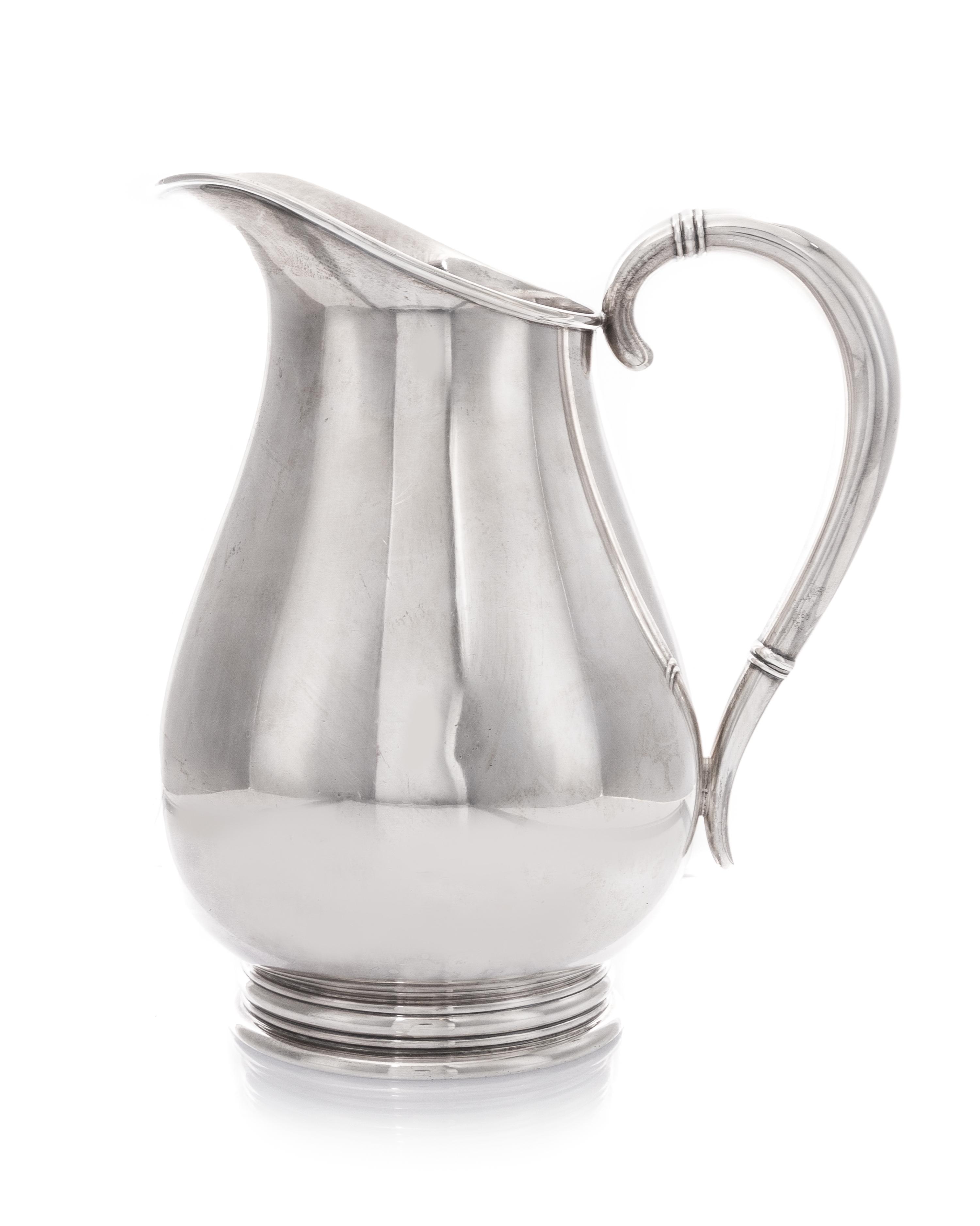 An American Silver Pitcher, International Silver Co., Meriden, CT, in the Royal Danish pattern, of baluster form, the handle having ban