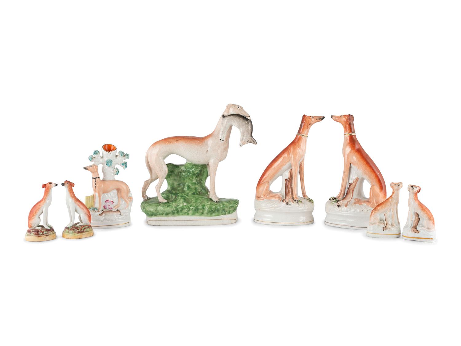 Eight Staffordshire Glazed Earthenware Hounds