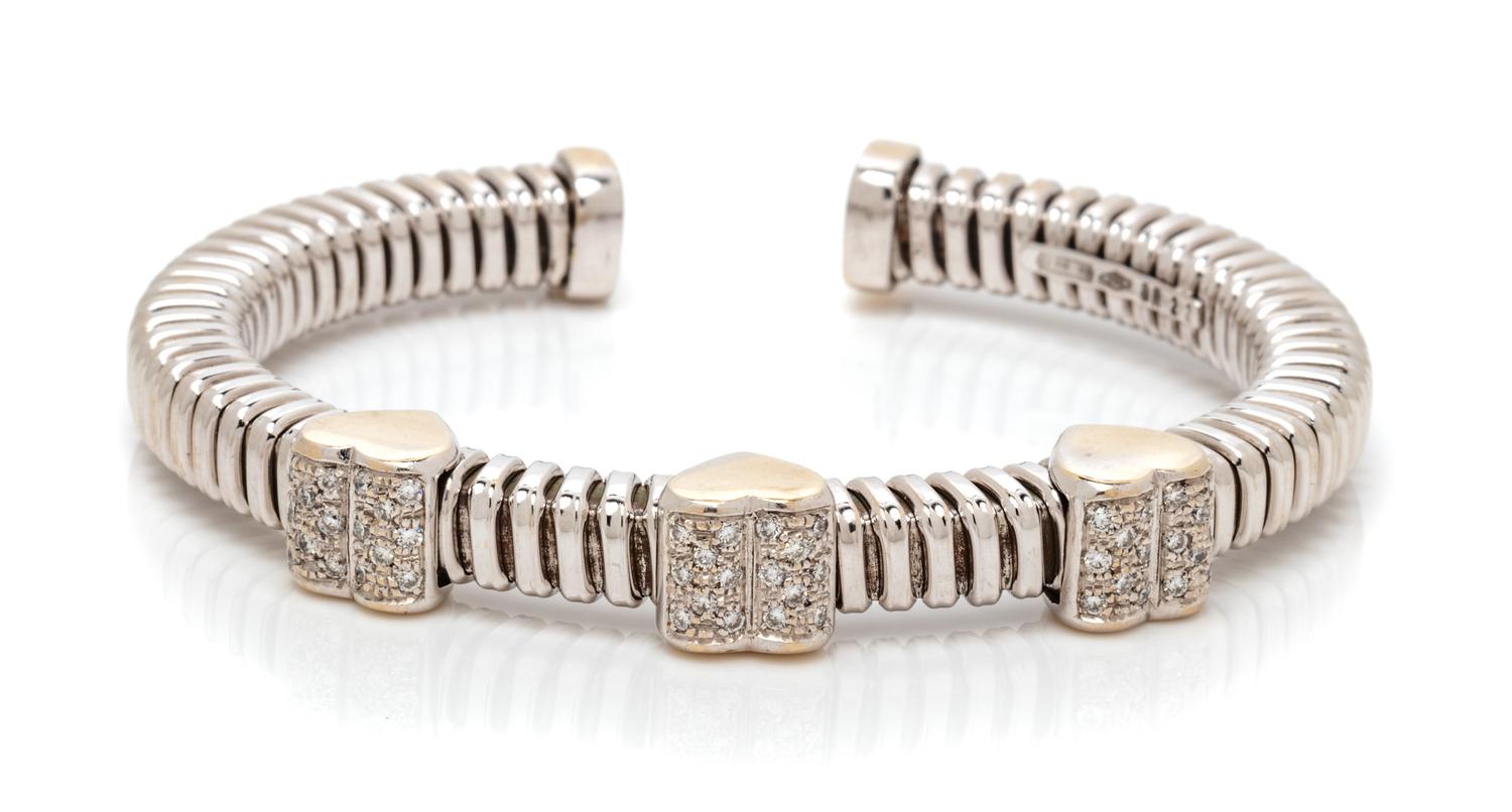 An 18 Karat Bicolor Gold and Diamond Heart Motif Cuff Bracelet, Italian, 21.00 dwts.