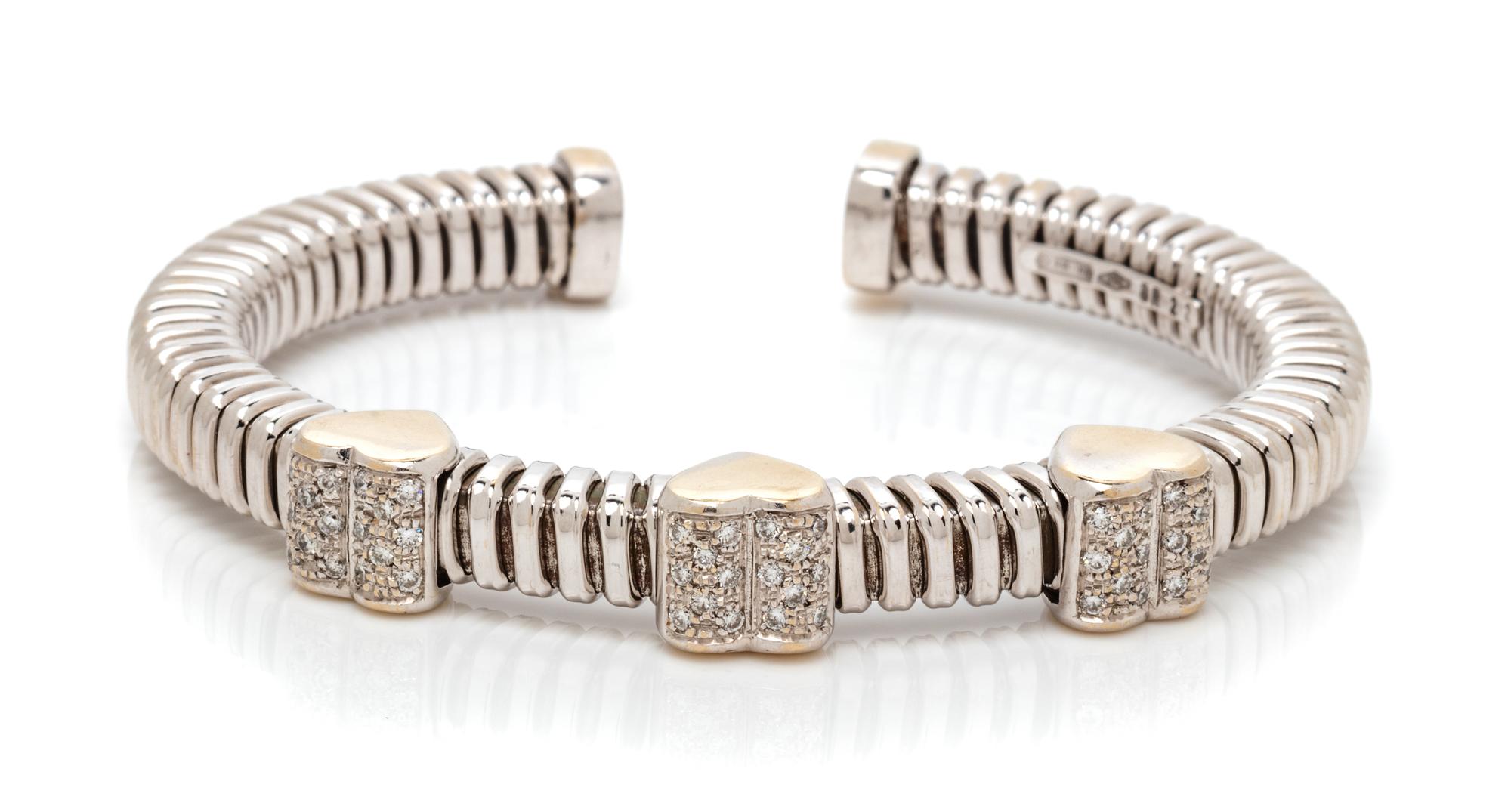 An 18 Karat Bicolor Gold and Diamond Heart Motif Cuff Bracelet, Italian, 21.00 dwts.