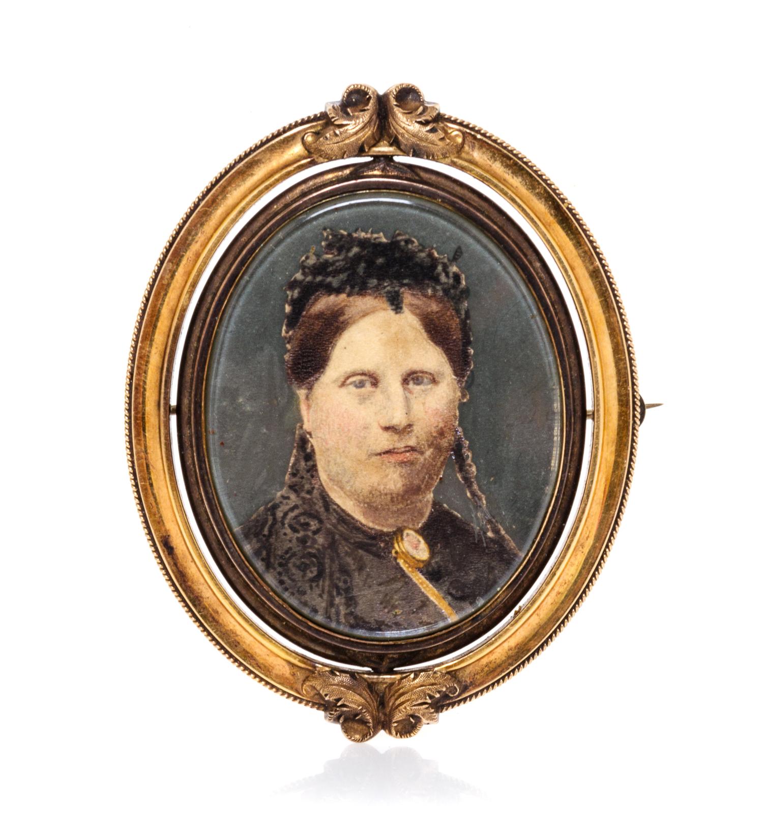 A Victorian Gilt Metal Portrait Brooch Height 2 7/8 inches.