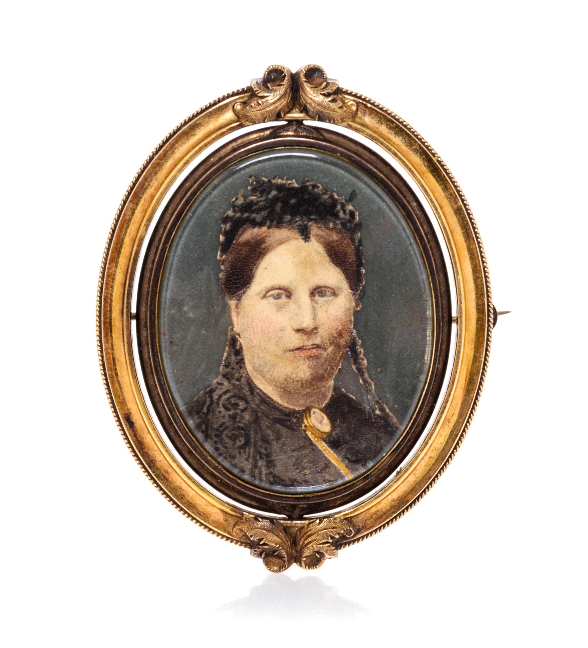 A Victorian Gilt Metal Portrait Brooch Height 2 7/8 inches.