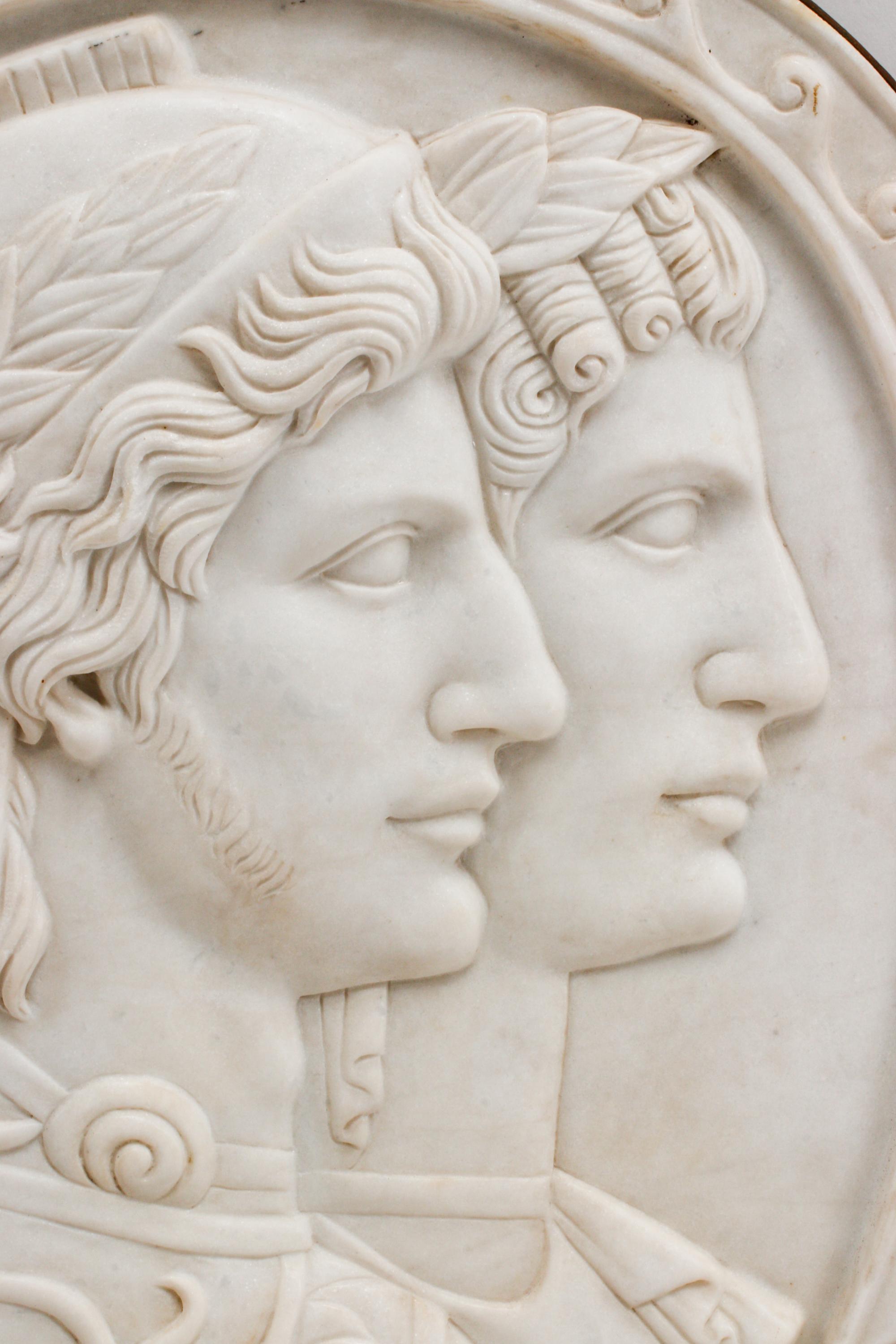 An Italian Carved Marble and Iron Mounted Double Profile Plaque