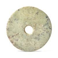 A Chinese Archaistic Mottled Pale Green Jade Bi Disc
