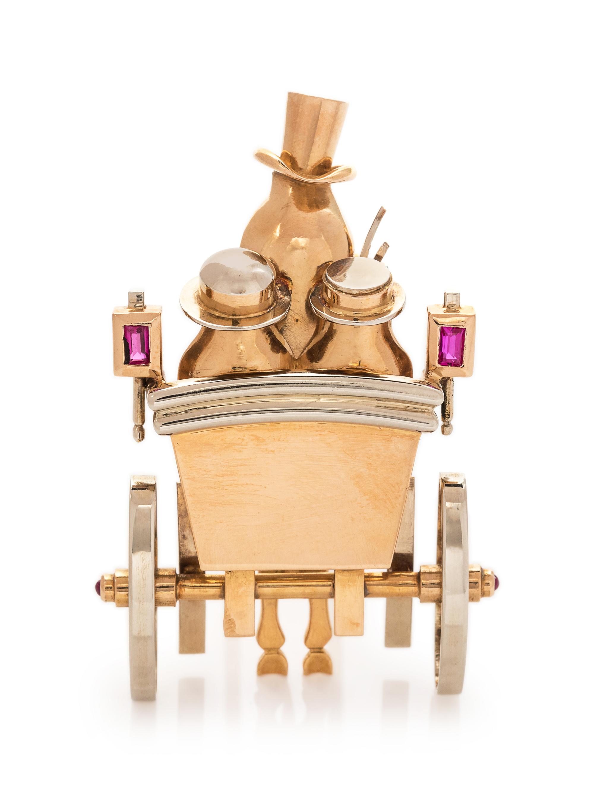A Retro Bicolor 18 Karat Gold and Ruby Carriage Motif Brooch, Andre Col,