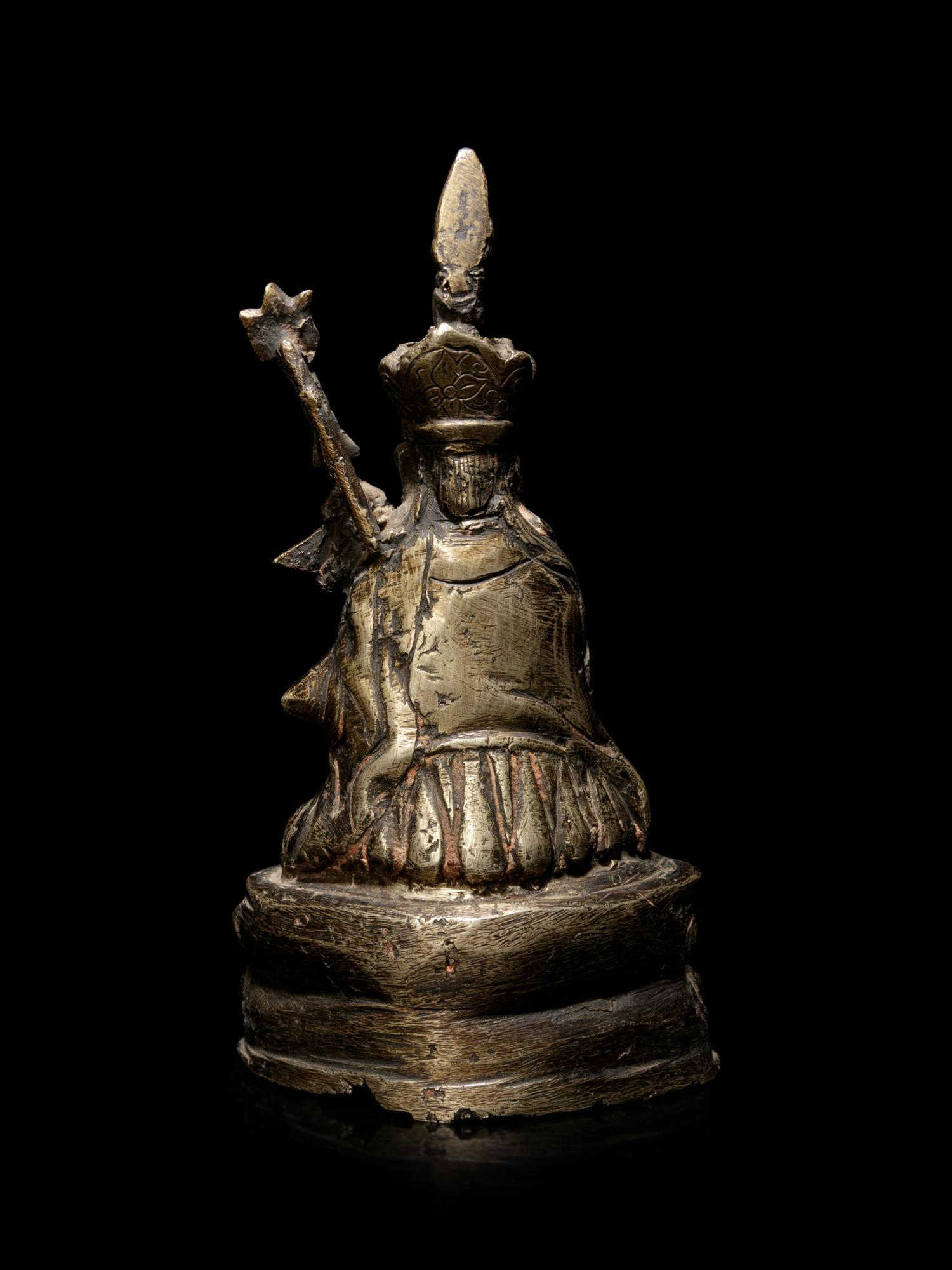 A Sino-Tibetan Silvered Metal Figure of Padmasambhava