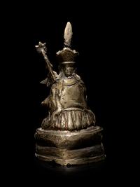 A Sino-Tibetan Silvered Metal Figure of Padmasambhava