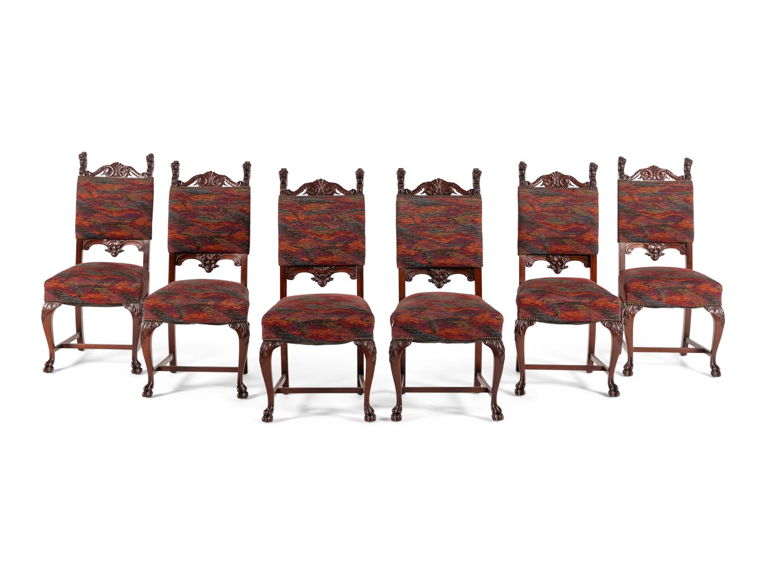 A Renaissance Revival Carved Mahogany Dining Table and Set of Six Chairs