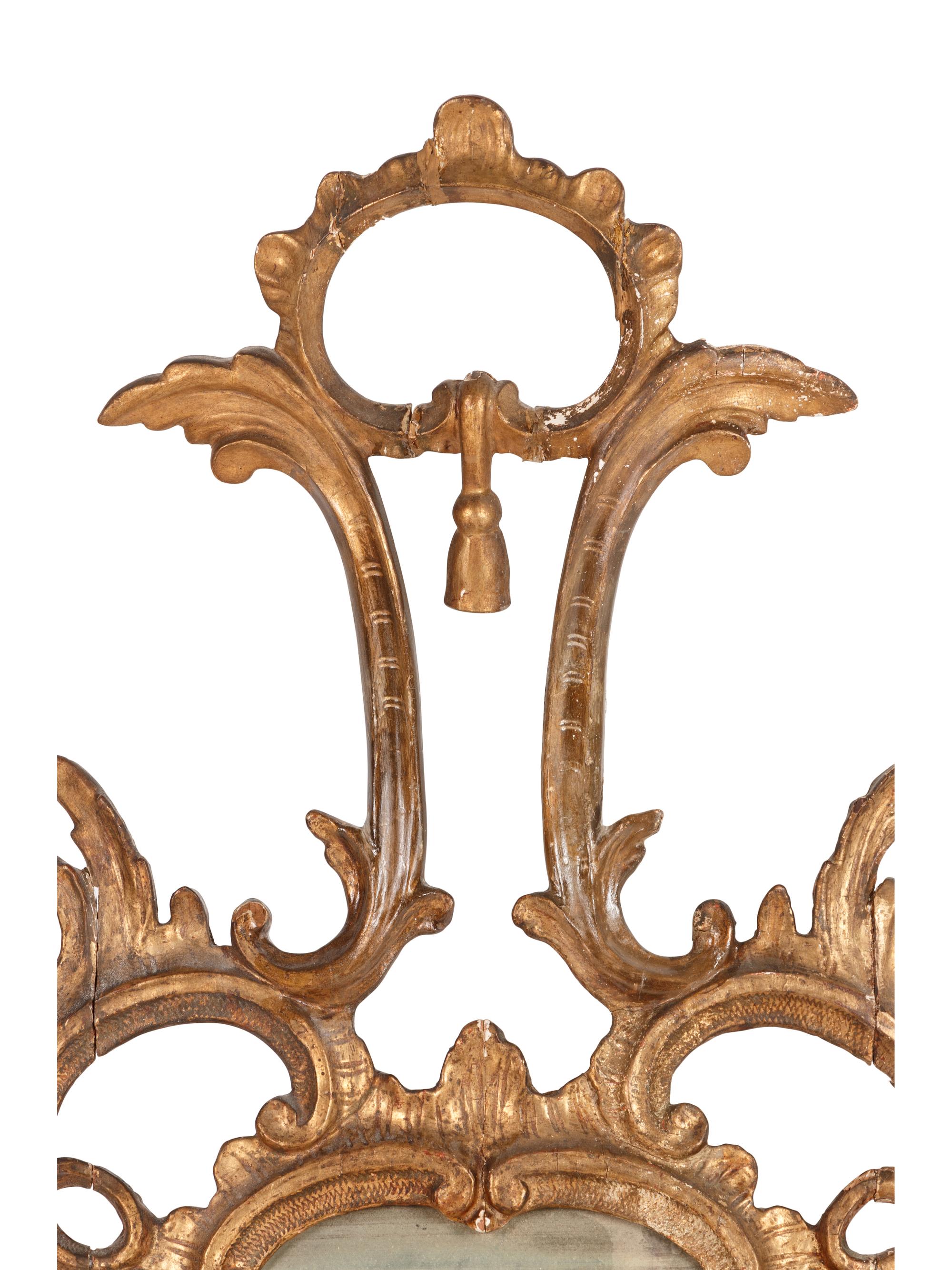 An Italian Baroque Style Giltwood Mirror