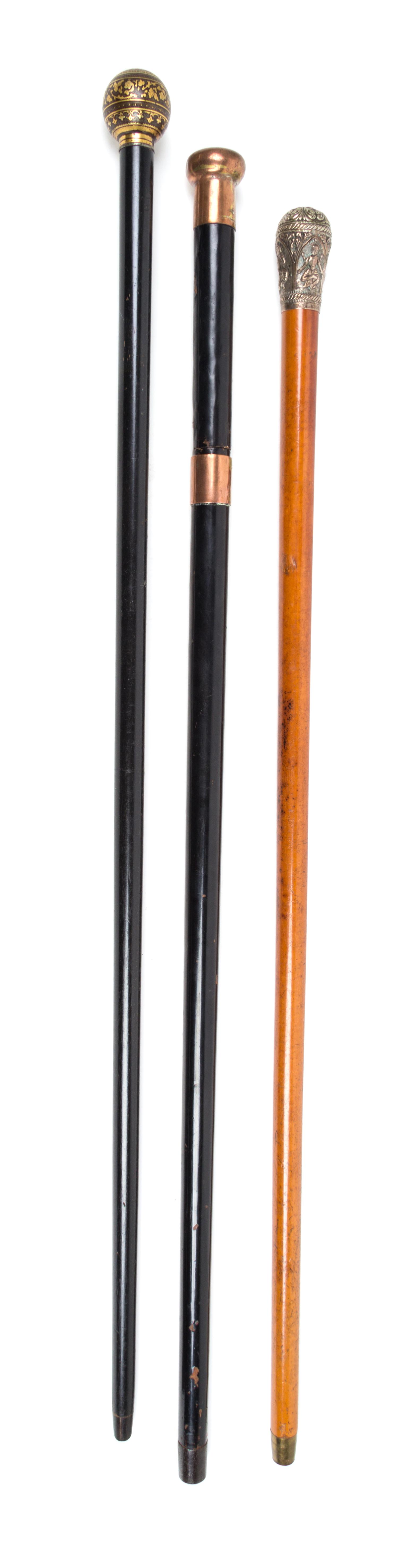 Three Knop Handled Canes Length of longest 36 1/4 inches.